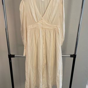Champagne/ cream dress with subtle gold stripe detail and buttons.